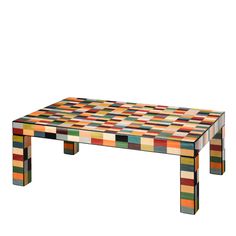 a multicolored coffee table sitting on top of a white floor