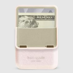 a pink case with money sticking out of it