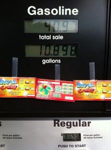 the gas pump has three packets of gummy bears on it