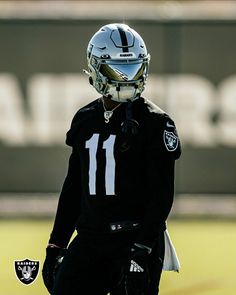 a football player wearing a helmet on the field