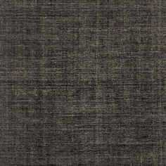 an image of a dark colored fabric textured with some sort of stain on it