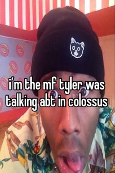 a man with his tongue out and wearing a hat that says i'm the nf tyler was talking at in colossus