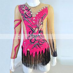 a woman's pink and black latin dance dress with fringes on the bottom