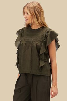 Timeless and feminine. The Aida Blouse, crafted in organic cotton with beautiful pin tucking and ruffle details, exudes a subtle romantic charm. Short-sleeved shirt with neck ruffle, pleat, and shirring detail at yoke, cascading ruffle sleeve, and loop and button closure with slit at back 100% Organic Cotton Cambric 43"" in Length Ethically Made in India Color Tops, Olive Green Color, Olive Color, Cotton Blouse, Neck Ruffle, Pin Tucks, Cotton Blouses, Green Colors, Olive Green