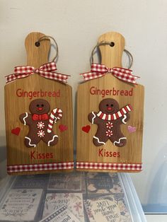 two wooden gingerbread cookies are on display