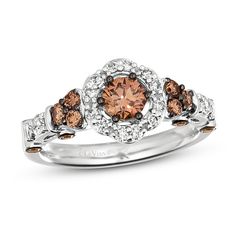 a white gold ring with brown and white diamonds