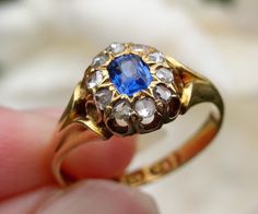 Free shipping!  This is an extremely beautiful Victorian blue sapphire and old cut diamond cluster ring. The vibrant royal blue sapphire of .33 carat is surrounded by a sparkly halo of SI, H/I  old rose cut diamonds. The diamonds total .2 carat. Like most antique rings, the gold has a real glow to it. The ring is perfectly proportioned, with graceful shoulders and is in excellent condition for its age.  Fully hallmarked.  Current retail value for age, diamond quality and content is au$3,450 as p Heirloom Blue Sapphire Ring With Rose Cut Diamonds, Antique Blue Diamond Ring For Anniversary, Antique Blue Diamond Ring With Rose Cut, Blue Sapphire Ring With Rose Cut Diamonds For Anniversary, Anniversary Blue Sapphire Ring With Rose Cut Diamonds, Antique Blue Diamond Ring Hallmarked, Antique Blue Sapphire Diamond Ring, Vintage Blue Ring With Single Cut Diamonds, Antique Blue Diamond Ring With Center Stone