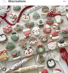 a table topped with lots of christmas themed cookies and other decorations on top of it