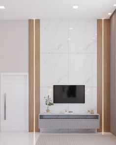 a tv mounted on the wall in a white room