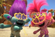 two cartoon characters with bright colored hair and sunglasses