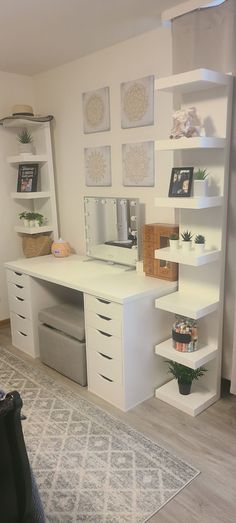 a white desk with drawers and shelves in a living room next to a rug on the floor