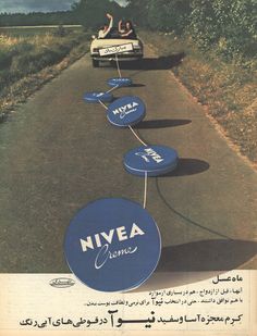 an advertisement for nivea creme with people in a car driving down the road