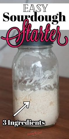 a mason jar filled with sourdough starter ingredients