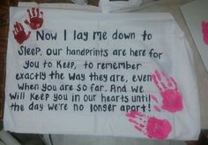 a handprinted sign on a table with pink and red hands in the background