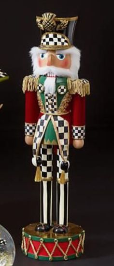 a nutcracker is standing next to a plate