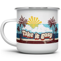 a white coffee mug with the words take it easy on it and palm trees in the background