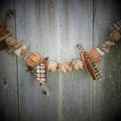 a wooden fence with some items hanging from it's sides and on the side