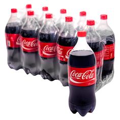 six bottles of coca - cola are lined up on a white surface, one is red and the other is black