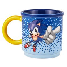 a blue and yellow sonic mug with an image of the character on it's side