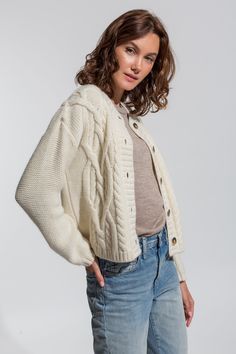 The Alicia Adams Alpaca Buckley Cardigan is a brand new cable knit cardigan. With bold colors and twisting cable knit details, this baby alpaca cardigan creates an effortless elevated look. 100% baby alpaca | dry clean only Proudly fair-trade made in Peru. Elegant White Merino Wool Cardigan, Cozy White Cashmere Cardigan, Classic White Wool Cardigan, Classic Cream Merino Wool Cardigan, Classic White Merino Wool Cardigan, White Merino Wool Cardigan For Winter, Cozy White Merino Wool Outerwear, White Merino Wool Cardigan For Fall, Cozy White Wool Cardigan