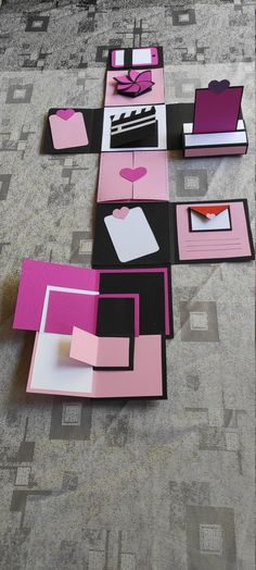 pink and black paper cut out into squares