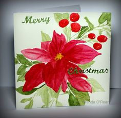 a christmas card with red flowers and green leaves