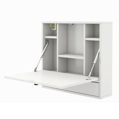 a white desk with two open shelves and a green plant