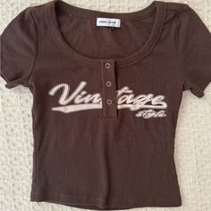 Y2k Brown Baseball Tee From Urban Revival! Never Worn No Flaws New W/O Tags , Size Xs-S Brown Fitted Graphic Print Tops, Brown Fitted Top With Graphic Print, Fitted Brown Top With Graphic Print, Brown Cotton Y2k Top, Trendy Brown Tops With Text Print, Brown Y2k Tops With Graphic Print, Vintage Brown Top With Text Print, Vintage Brown Tops With Text Print, Brown Y2k Tops For Summer