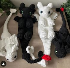 crocheted stuffed animals sitting on top of a table