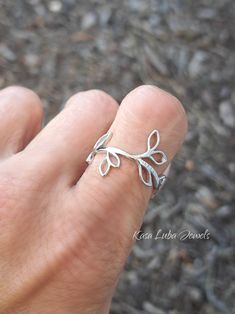 Sterling Silver vine ring, leaves - womens, leaf ring, autumn jewelry, 925 silver jewelry, gifts for mom *IF YOUR SIZE ISNT SHOWING, MESSAGE ME. I might be sold out and will be able to replenish shortly* Top of ring height: 19mm Band width: 9.2mm Metal: 925 sterling silver Plating: rhodium plated Finish: high polish This is a High Polished solid sterling silver ring with Rhodium plating to prevent tarnishing. Nothing but the best from my custom jewelry store. --------------------------- Please follow care instructions. Any rings with stones, regardless where you purchase, must be removed when washing hands or using hair gels or hair creams, and even chemicals and cleaners. To clean jewelry, you can use a toothbrush and some hand soap for simple easy cleaning. This is costume jewelry, not r Minimalist Sterling Silver Leaf Jewelry, Minimalist Leaf-shaped Sterling Silver Jewelry, Leaf-shaped Sterling Silver Jewelry For Anniversary, Adjustable Silver Leaf Jewelry, Leaf-shaped Jewelry For Gift, Dainty Sterling Silver Leaf Jewelry, Elegant Silver Leaf Shaped Ring, Silver Leaf-shaped Adjustable Jewelry, Elegant Silver Leaf-shaped Ring