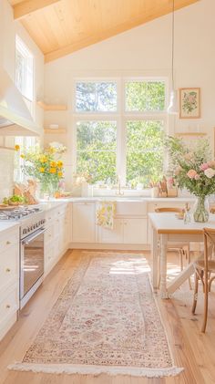 a kitchen with a rug on the floor next to a stove top oven and sink