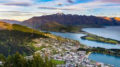 an aerial view of the town of queenstown and lake wakat in new zealand