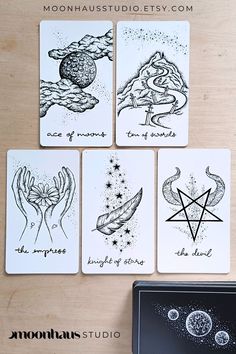 four cards with different designs on them