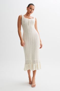 Vacation readyThe SYLVIE Frill Knit Midi Dress embodies elegance with a touch of whimsy. Featuring a square neckline that frames the décolletage beautifully, this dress exudes sophistication. The scalloped design adds a playful yet refined touch, while the centre front tie detail adds a hint of charm. With a square back detail that adds intrigue, this dress is as captivating from the back as it is from the front. Its bodycon silhouette hugs your curves in all the right places, while the midi length exudes timeless elegance. Complete with a skirt hem frill for added flair, this dress is perfect for any occasion. Unlined for a lightweight and breathable feel, the Sylvie Midi Dress is a versatile and chic addition to your wardrobe. Scalloped Design, Beige Dresses, Date Night Dresses, Knit Midi, Knit Midi Dress, Crepe Dress, Birthday Dresses, Midi Dresses, Spring Dresses