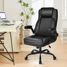 an office chair sitting in front of a desk with a laptop computer on top of it