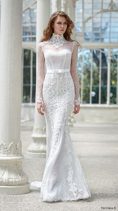 a woman in a white wedding dress standing next to pillars and columns, wearing a high neck