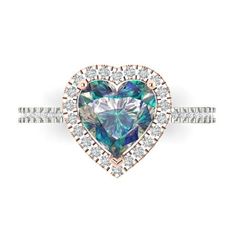 a heart shaped diamond ring with blue and green stones in the center, surrounded by white diamonds