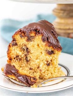 a close up of a piece of cake on a plate with a fork in it