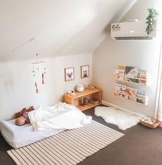 The most amazing Montessori homes I've seen don't belong to bloggers or influencers. They belong to busy parents who create lovely spaces without any fanfare. Today I'm sharing some of these spaces. I find all of these rooms really refreshing, I'm not going to add much commentary other than to say I hope you enjoy these and feel somewhat inspired to bring a little Montessori into your home! This is such a sweet space. There is a lot in this small Montessori Shared Bedroom With Parents, Montessori Playroom Bedroom, Floor Bed Toddler Montessori Bedroom, Montessori Floor Bed Room, Kids Mattress On Floor, Montessori Yes Space, Montessori Bedroom For Twins, Montessori Bedroom 12 Months, Montessori Bedroom 6 Months