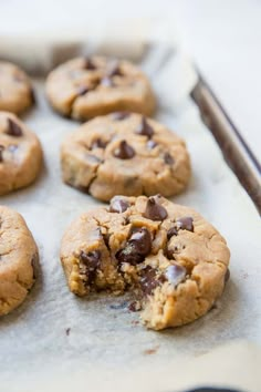 chocolate chip cookies on a baking sheet ready to be eaten