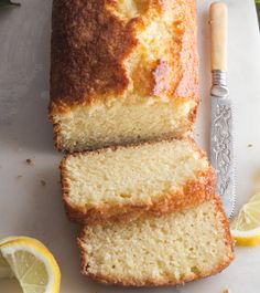 a loaf of lemon pound cake on a cutting board