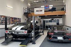 two cars parked in a garage next to each other