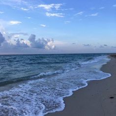 the beach has waves coming in to shore