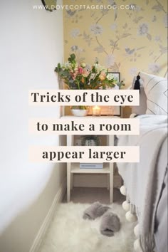 a bedroom with a white rug and flowers on the floor