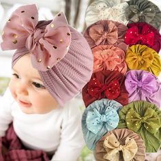 a baby girl wearing a headband with many different bows on it's head