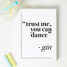 a framed print with the words trust me, you can dance and gin next to it