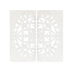 two white panels with intricate designs on each panel, one is cut out and the other has