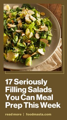 a plate filled with salad on top of a wooden table