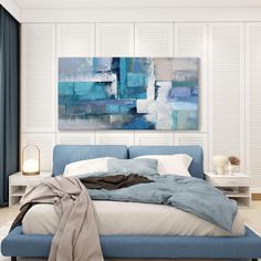 a bedroom with a large painting on the wall above the bed, and a blue headboard