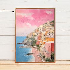 a painting hanging on the wall next to a wooden frame that says splash of saseras